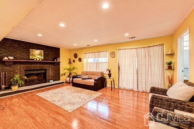 74 Briar Avenue Edison, NJ 08817 - Photo 24 of 30 a living room with furniture and a fireplace