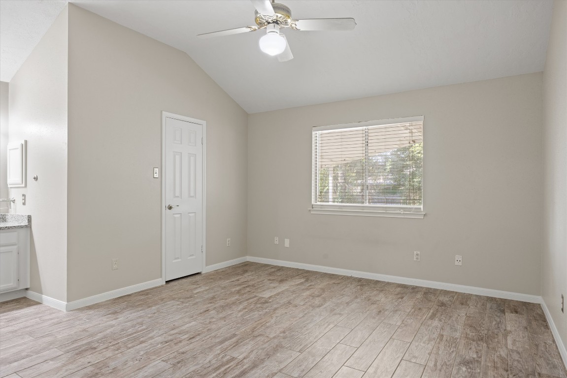 1511 Quail Run Road Pflugerville, TX 78660 - Photo 20 of 27 wooden floor in an empty room with a window