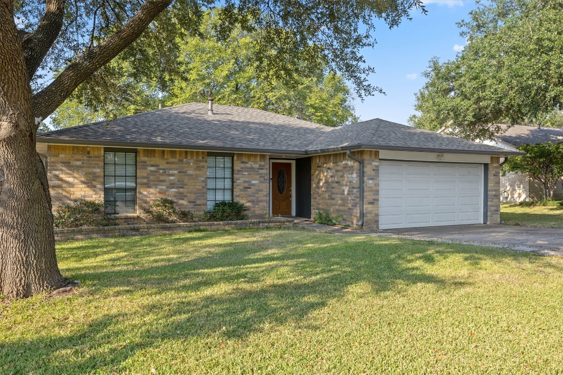 1511 Quail Run Road Pflugerville, TX 78660 - Photo 2 of 27 a front view of a house with a garden