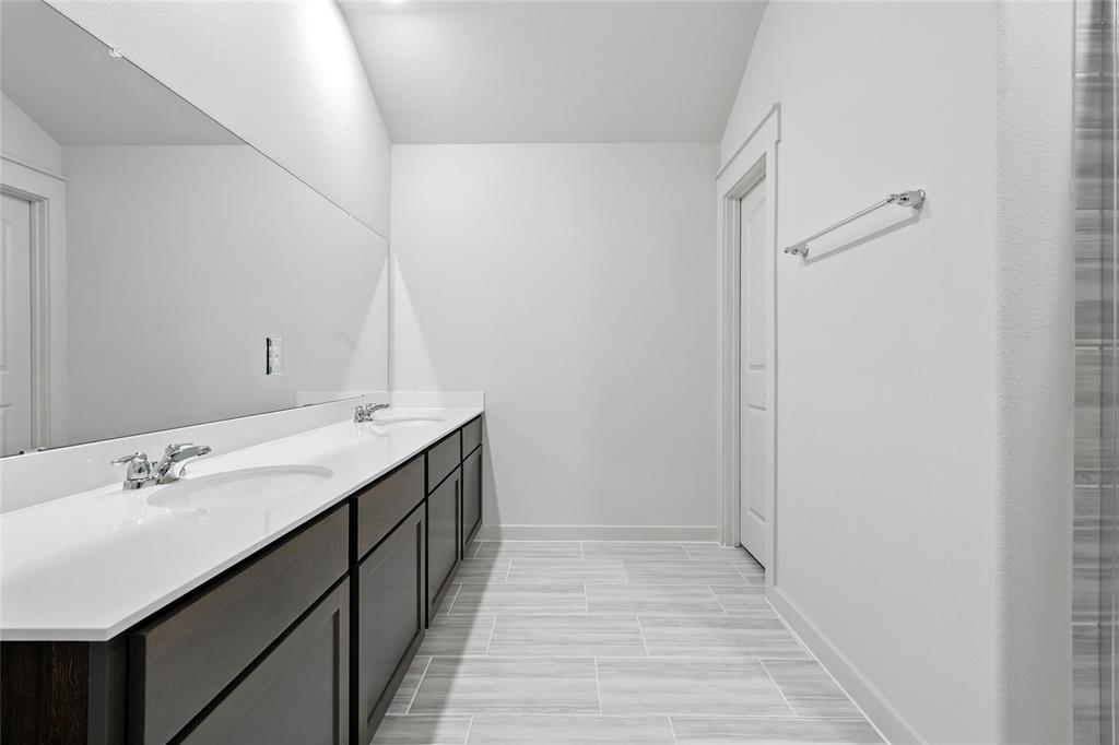 2623 Stowers Street Anna, TX 75409 - Photo 17 of 36 a bathroom with a sink and a mirror