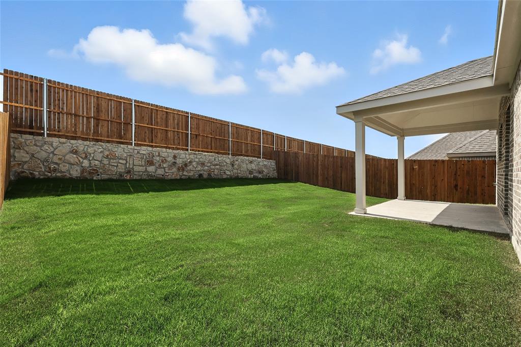 2623 Stowers Street Anna, TX 75409 - Photo 21 of 36 a view of a backyard with a small cabin