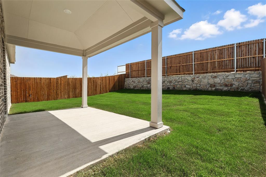 2623 Stowers Street Anna, TX 75409 - Photo 22 of 36 a view of a backyard with a garden
