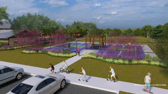 aerial view of a house with a garden and lake view