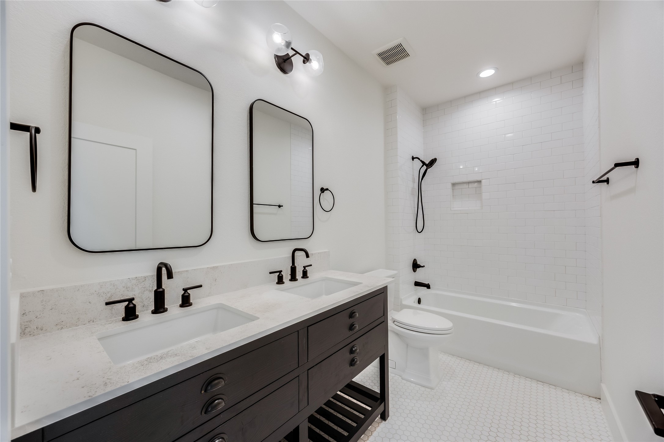 288 Smoke Tree Circle Dripping Springs, TX 78620 - Photo 30 of 40 a bathroom with 2 sink double vanity and a mirror
