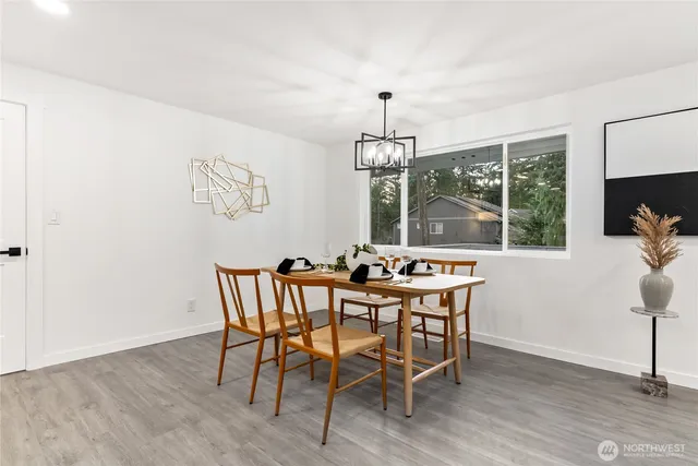 a view of a dining room with furniture window and outside view