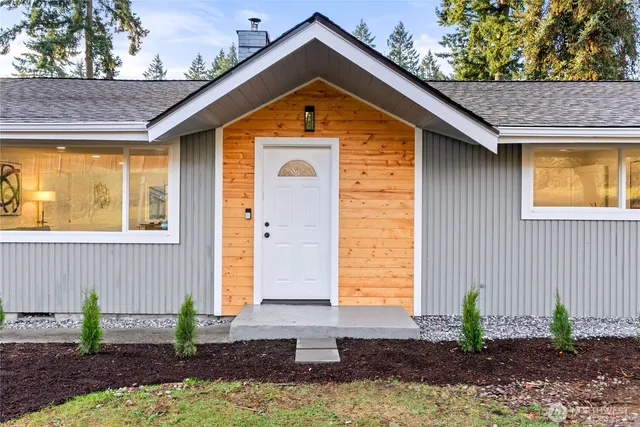 a front view of a house with garden