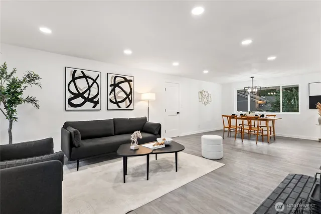 a living room with furniture and a table