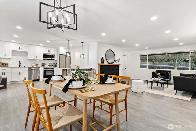 a view of a dining room with furniture window and wooden floor