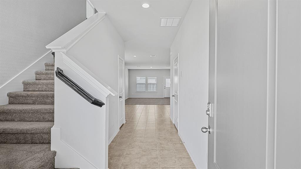 114 Mojave Road Boyd, TX 76023 - Photo 16 of 35 a view of a hallway with wooden floor and staircase