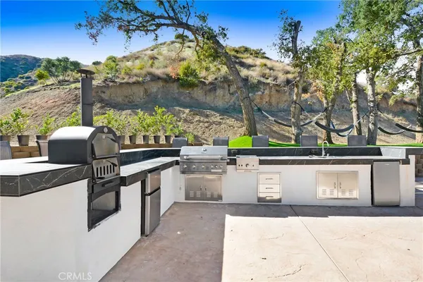 a view of a outdoor kitchen