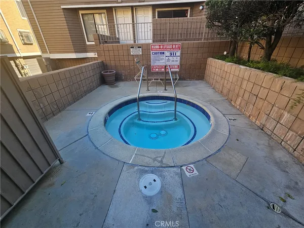 a view of a swimming pool with a patio