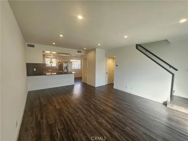 a view of kitchen with wooden floor