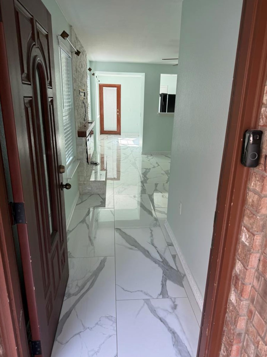 6600 Glebe Path Austin, TX 78754 - Photo 4 of 11 Step into a luminous entryway featuring glossy tile flooring and an inviting ambiance.