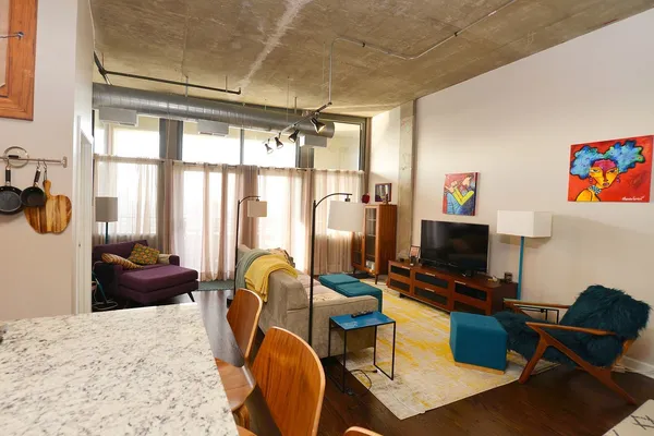 a workspace with furniture and a flat screen tv