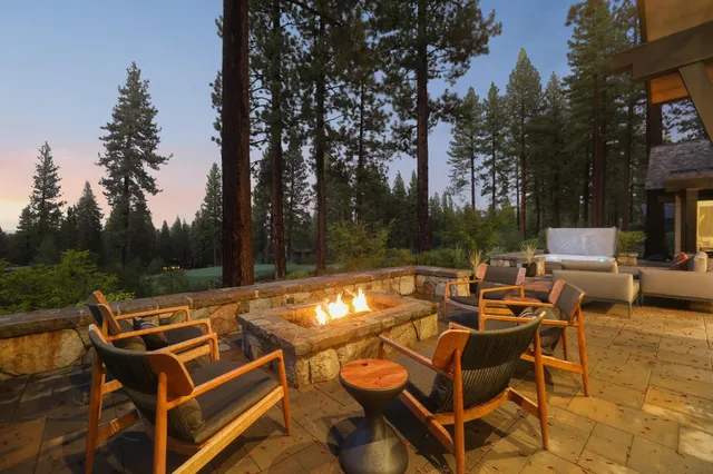 a view of a patio with chairs and a table