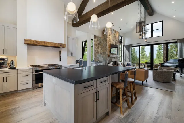 a kitchen with a sink cabinets and wooden floor