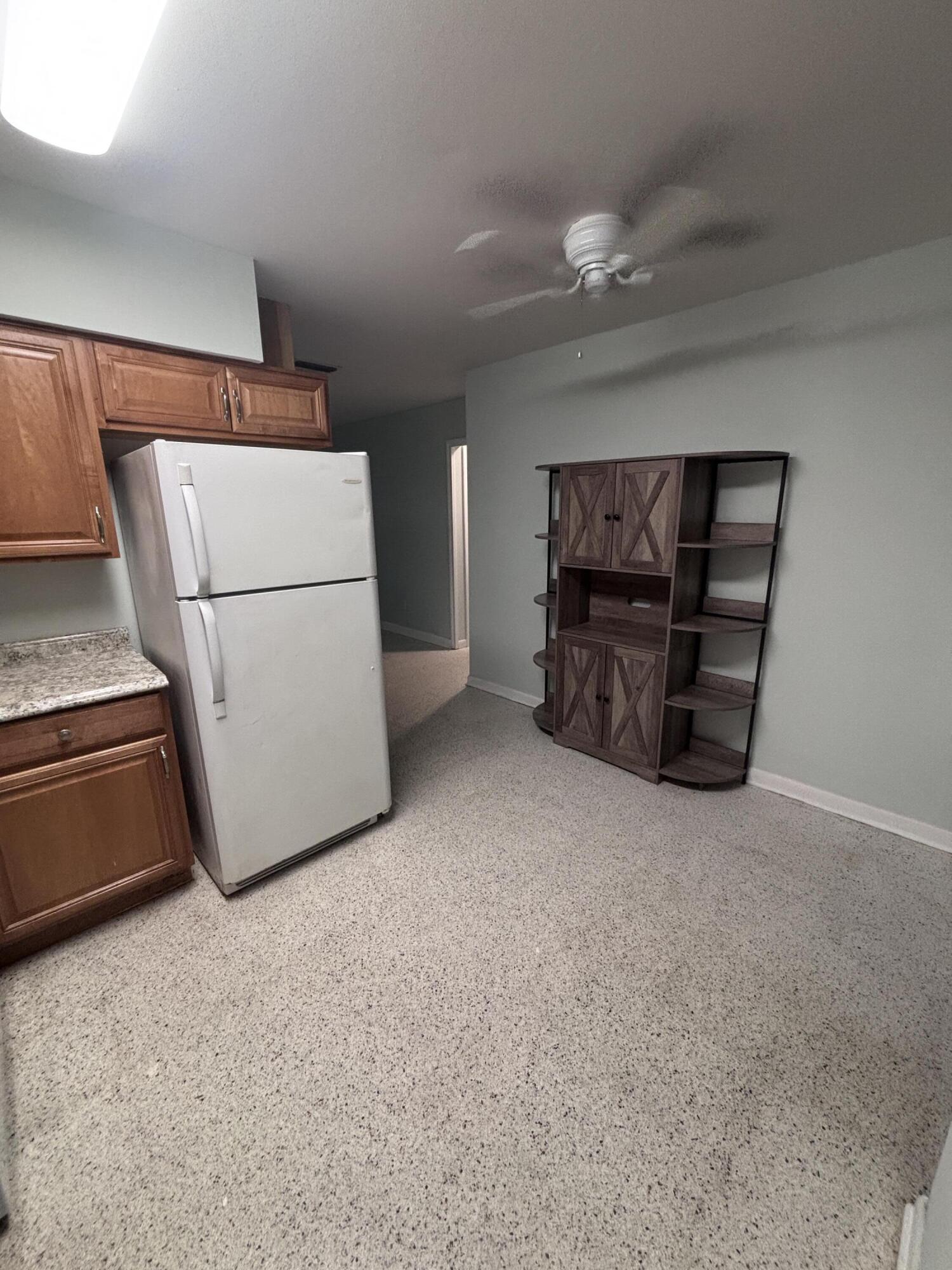 202 Balboa Street, Unit A Fort Pierce, FL 34949 - Photo 3 of 10 a view of kitchen and furniture