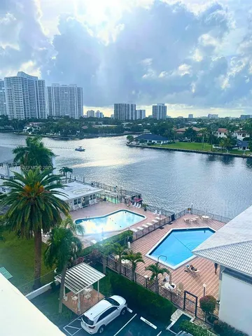 a view of a terrace with wooden floor and lake view