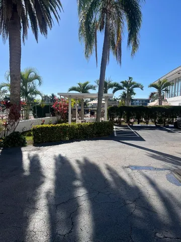 a view of swimming pool with outdoor seating and city view