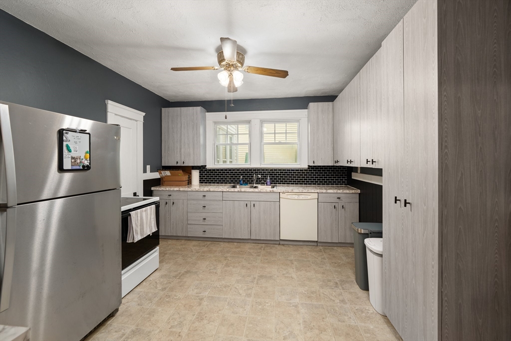 90 Meadow Road Woonsocket, RI 02895 - Photo 1 of 18 a kitchen with a refrigerator and a sink