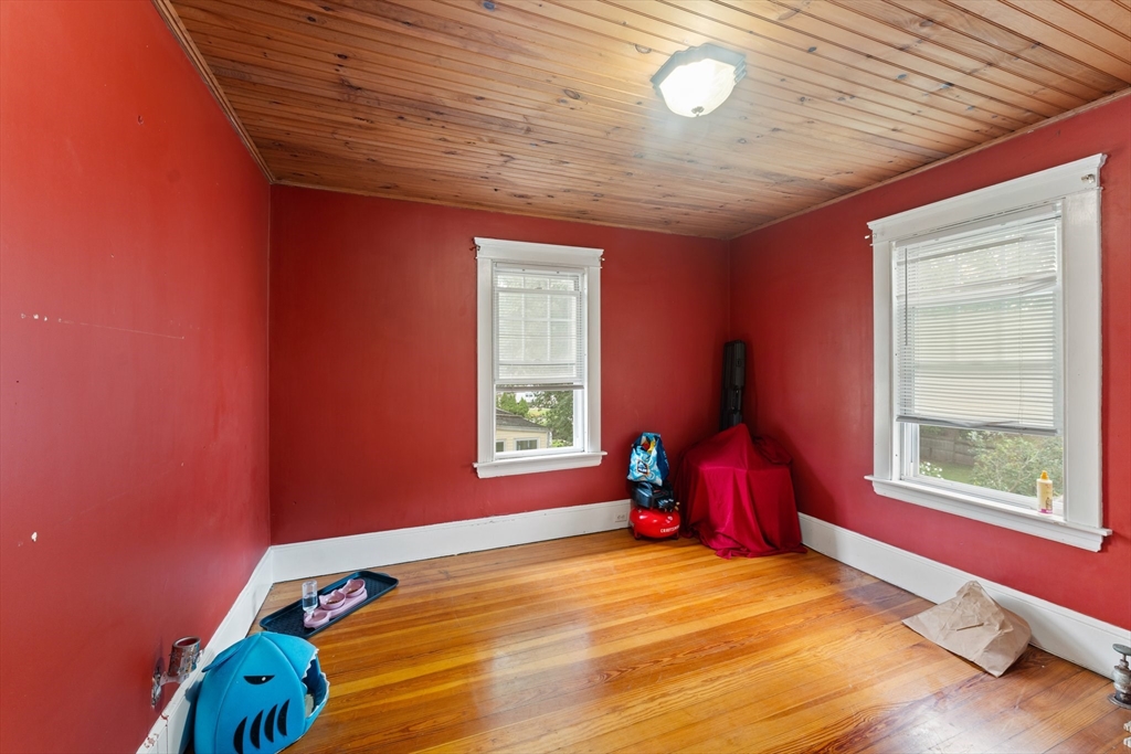 90 Meadow Road Woonsocket, RI 02895 - Photo 11 of 18 a bed sitting in a bedroom next to a window