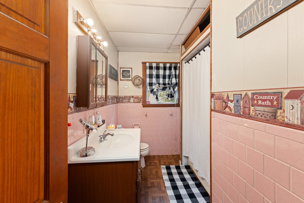 90 Meadow Road Woonsocket, RI 02895 - Photo 13 of 18 a bathroom with a sink a mirror and a shower