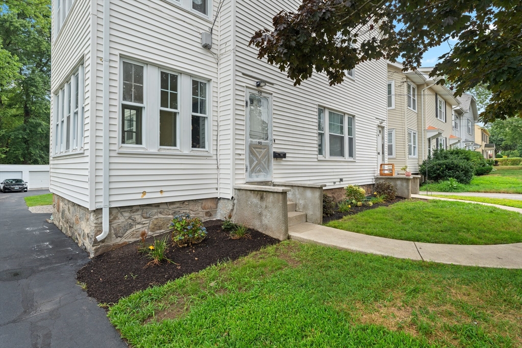 90 Meadow Road Woonsocket, RI 02895 - Photo 14 of 18 a front view of a house with a yard