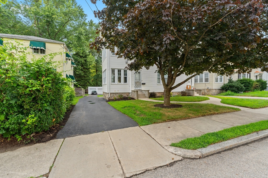 90 Meadow Road Woonsocket, RI 02895 - Photo 15 of 18 a front view of a house with yard and green space