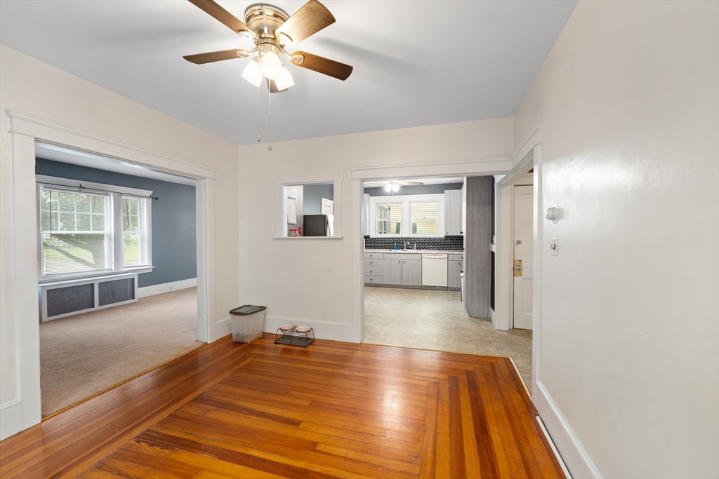 90 Meadow Road Woonsocket, RI 02895 - Photo 2 of 18 a view of a livingroom with wooden floor and a ceiling fan
