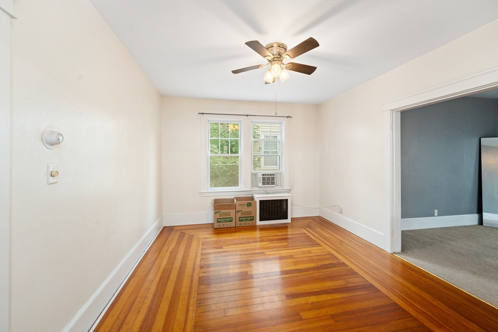 90 Meadow Road Woonsocket, RI 02895 - Photo 3 of 18 a view of empty room with wooden floor and fan