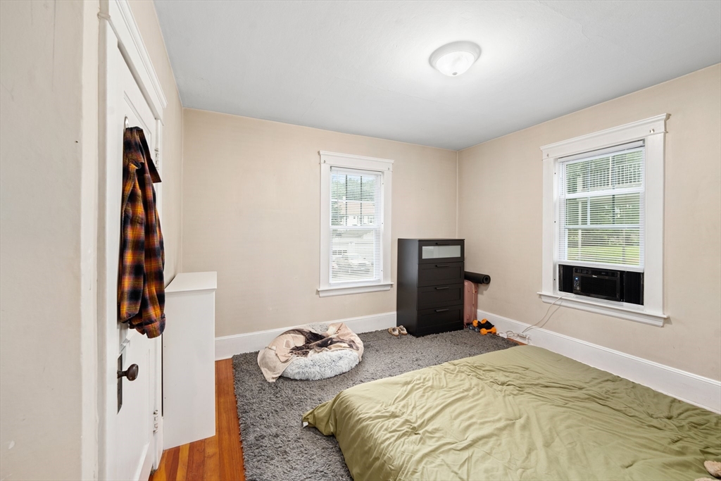 90 Meadow Road Woonsocket, RI 02895 - Photo 7 of 18 a bedroom with a bed and a window
