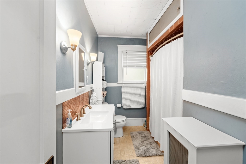 90 Meadow Road Woonsocket, RI 02895 - Photo 8 of 18 a bathroom with a sink a toilet and shower