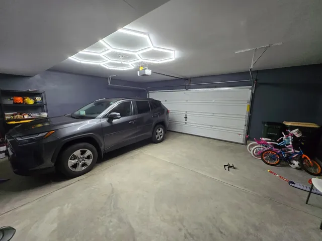 a view of a garage with parked cars