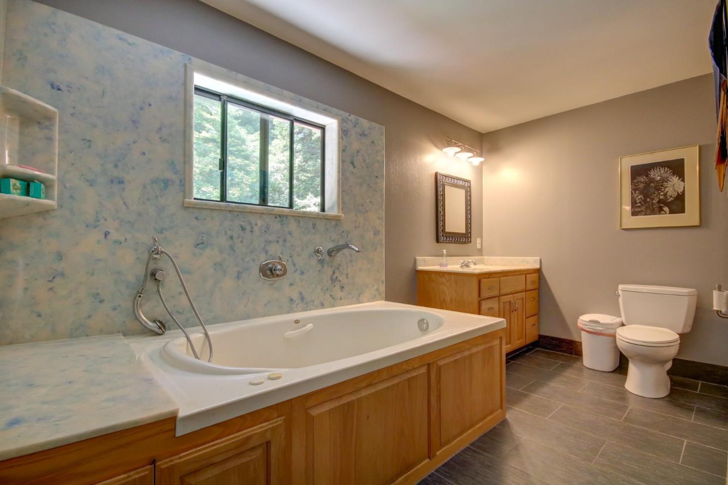 500 Hidden Canyon Watsonville, CA 95076 - Photo 13 of 37 a bathroom with a sink a toilet and a bathtub