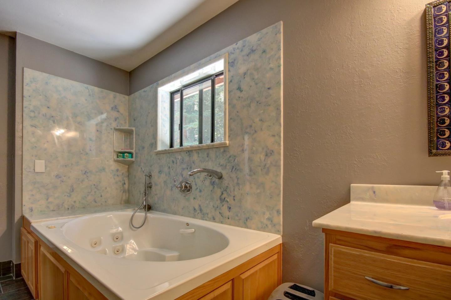 500 Hidden Canyon Watsonville, CA 95076 - Photo 14 of 37 a bathroom with a sink and a bathtub