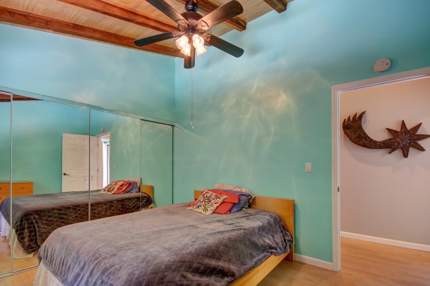 500 Hidden Canyon Watsonville, CA 95076 - Photo 16 of 37 a bedroom with two beds and a chandelier