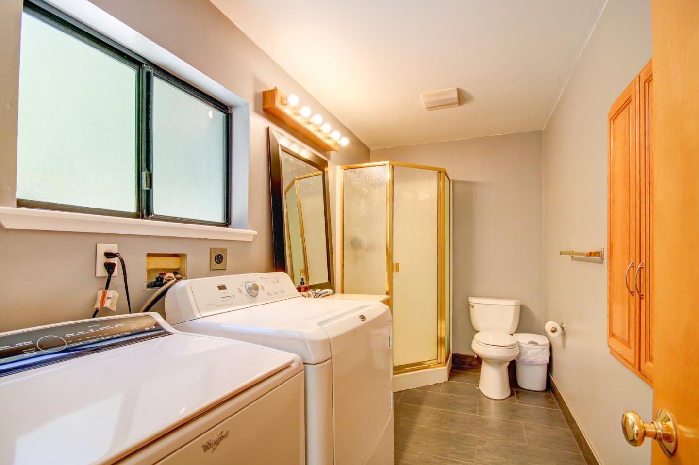 500 Hidden Canyon Watsonville, CA 95076 - Photo 18 of 37 a bathroom with a sink and a large mirror