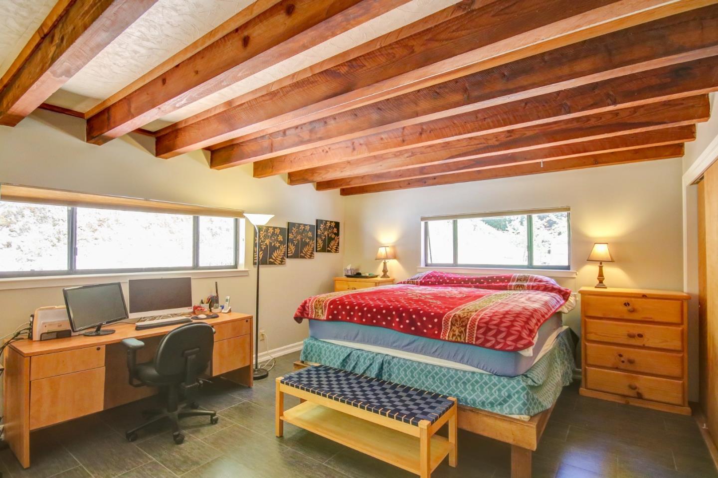 500 Hidden Canyon Watsonville, CA 95076 - Photo 19 of 37 a bedroom with a bed and wooden floor