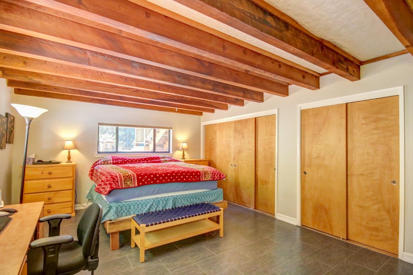 500 Hidden Canyon Watsonville, CA 95076 - Photo 20 of 37 a bedroom with a bed and wooden floor