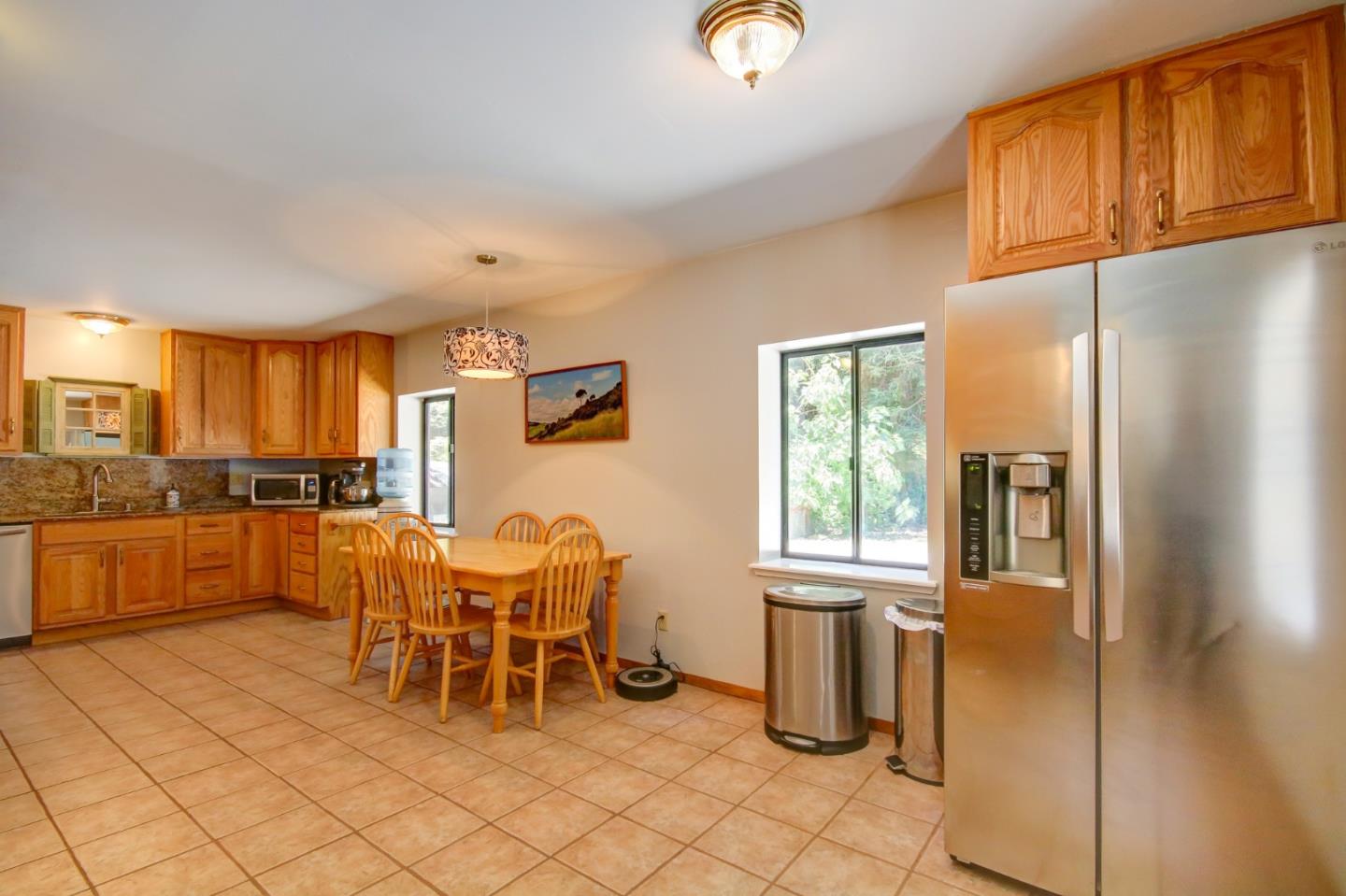 500 Hidden Canyon Watsonville, CA 95076 - Photo 2 of 37 a kitchen with a refrigerator and table chair