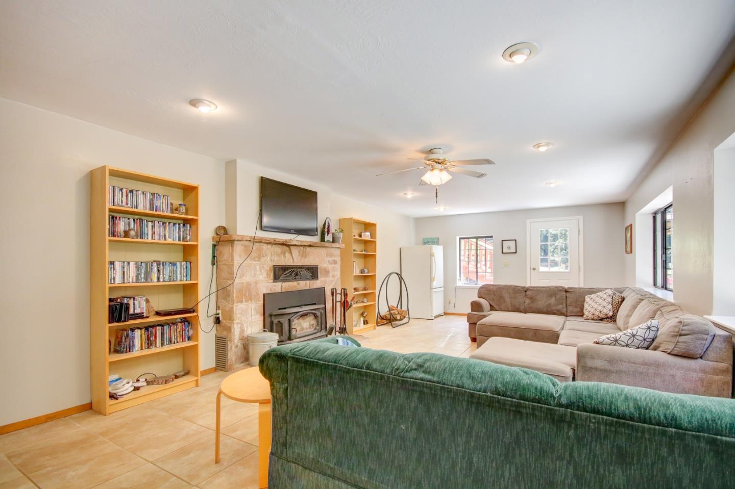 500 Hidden Canyon Watsonville, CA 95076 - Photo 27 of 37 a living room with fireplace furniture and a flat screen tv