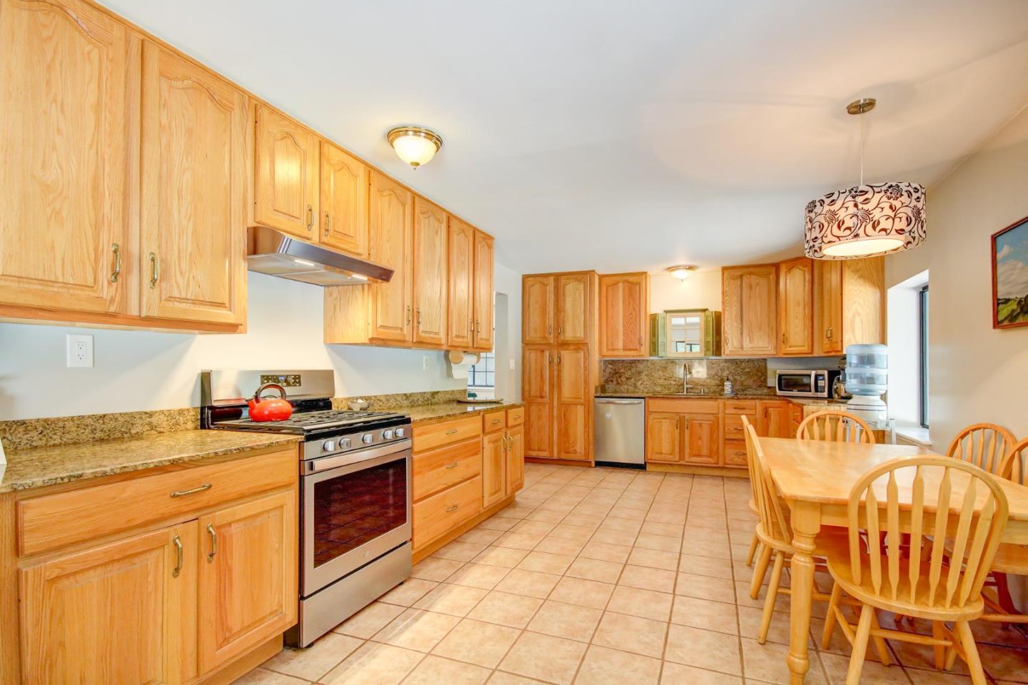 500 Hidden Canyon Watsonville, CA 95076 - Photo 10 of 37 a kitchen with stainless steel appliances granite countertop a stove a sink dishwasher and a refrigerator with cabinets
