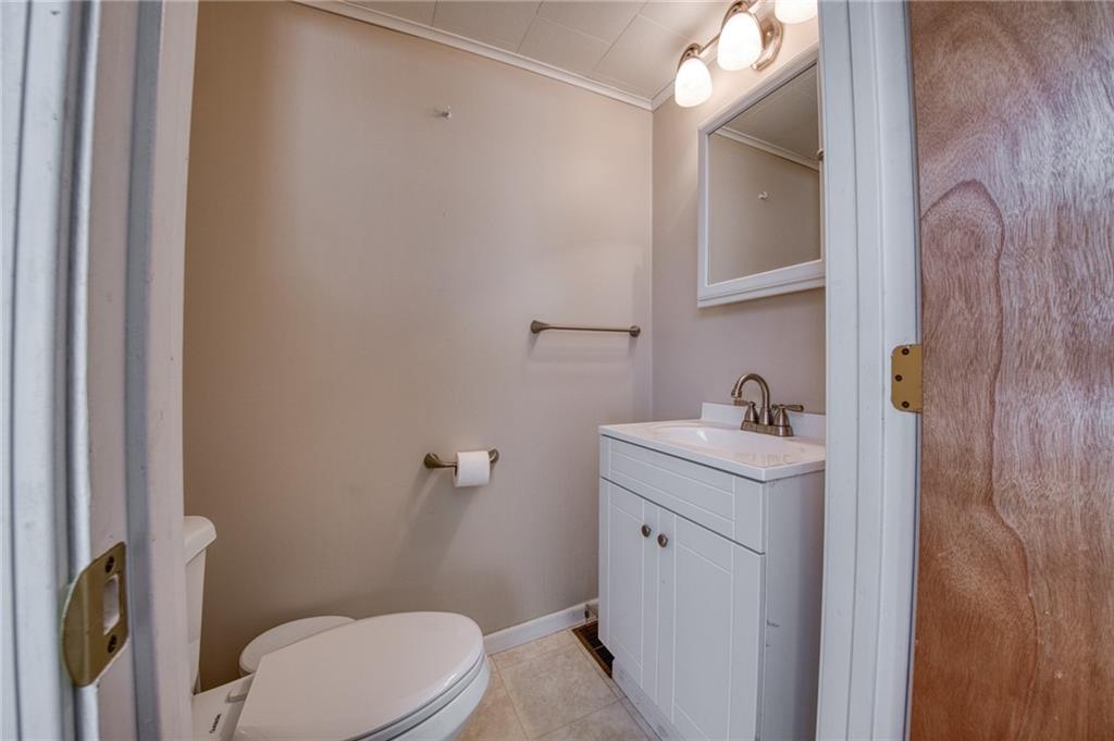 51 Sycamore Street Muse, PA 15350 - Photo 17 of 38 a bathroom with a sink a toilet and mirror