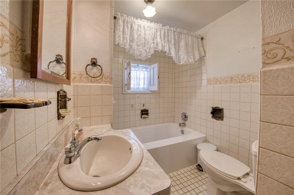 51 Sycamore Street Muse, PA 15350 - Photo 22 of 38 a bathroom with a toilet sink and shower