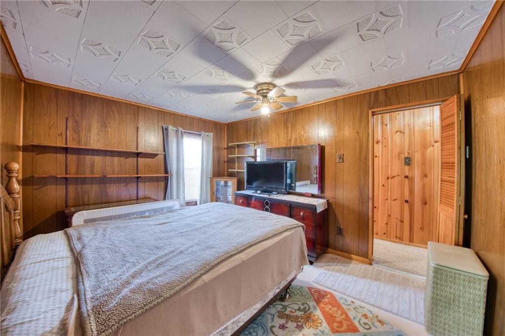 51 Sycamore Street Muse, PA 15350 - Photo 24 of 38 a bedroom with a bed a flat screen tv and a dresser