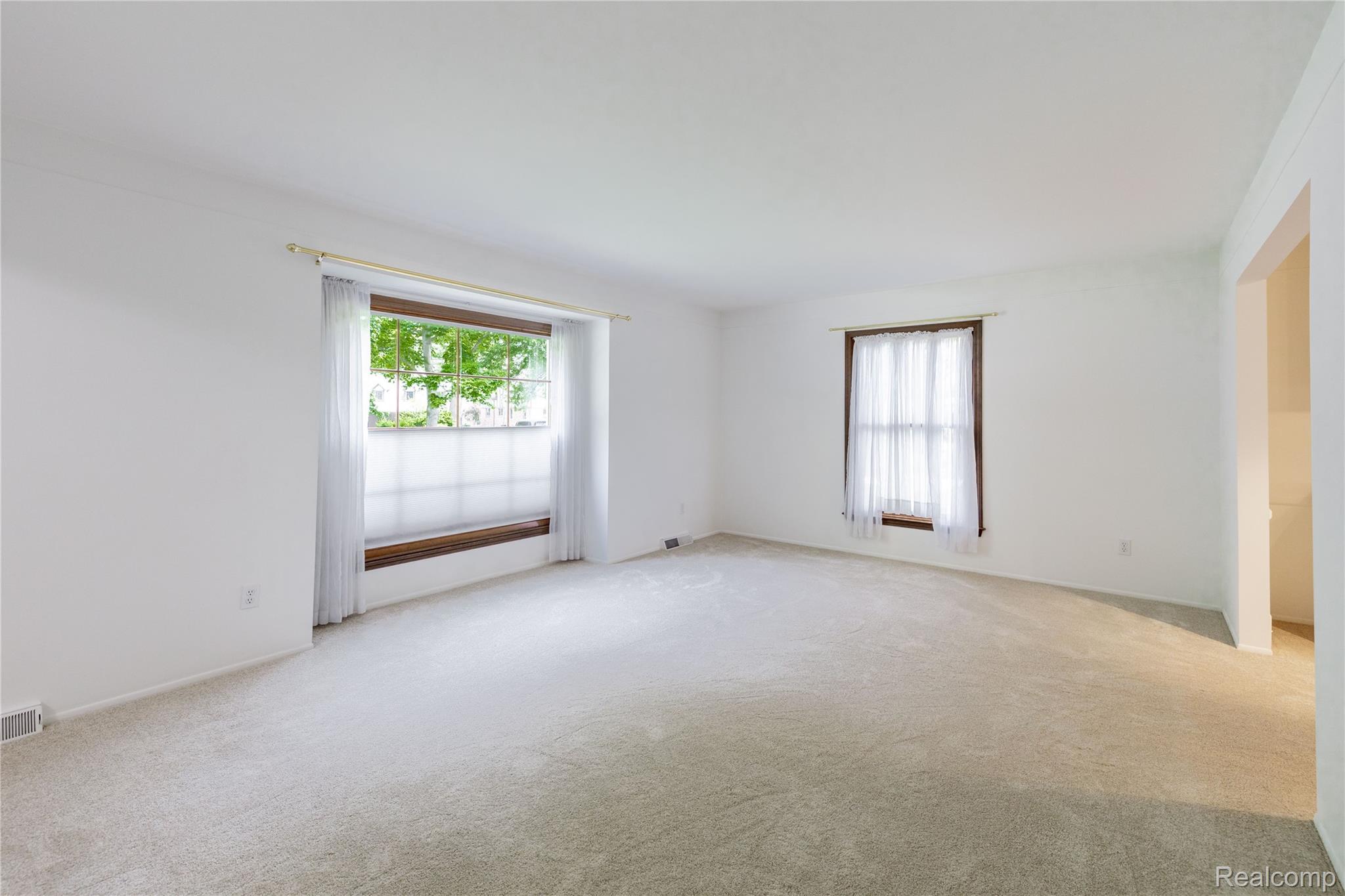7611 Ferry Road Grosse Ile, MI 48138 - Photo 20 of 51 Spacious interior room with light-colored carpeting and white walls