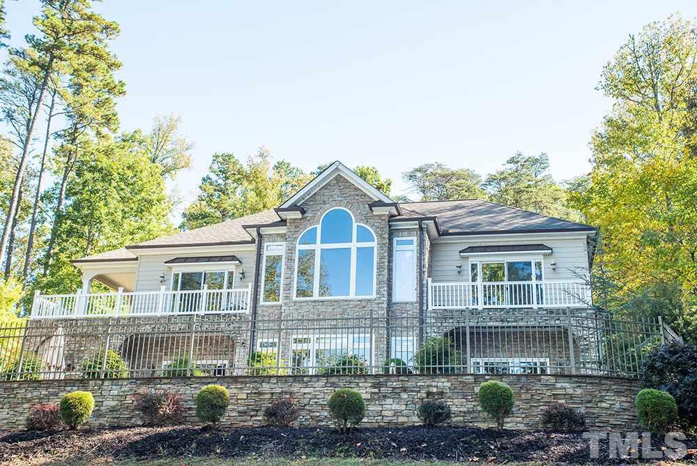 159 Duck Pointe Drive Roxboro, NC 27574 - Photo 1 of 30 a front view of a house with a garden and plants