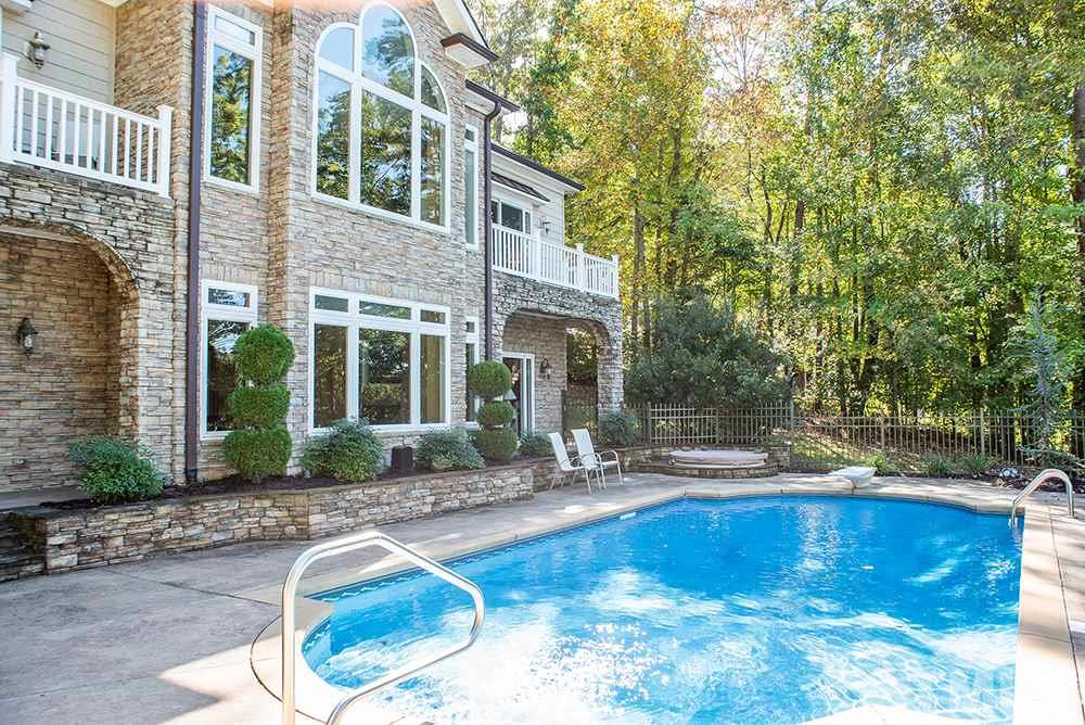 159 Duck Pointe Drive Roxboro, NC 27574 - Photo 2 of 30 a swimming pool with outdoor seating and yard