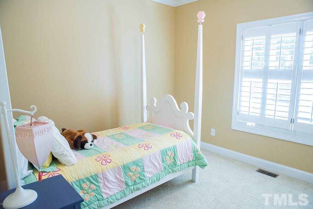 159 Duck Pointe Drive Roxboro, NC 27574 - Photo 17 of 30 a bedroom with a bed and a window