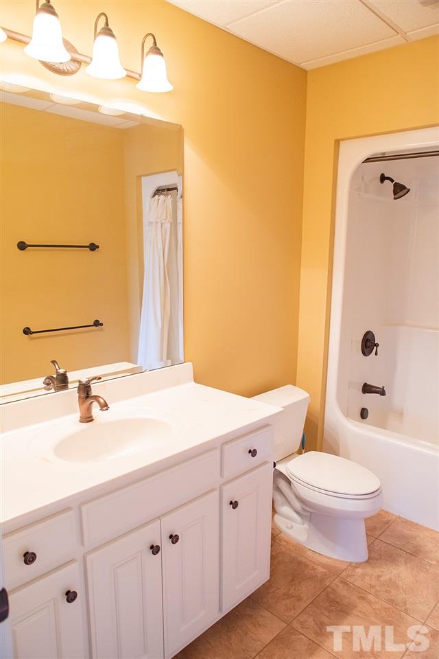 159 Duck Pointe Drive Roxboro, NC 27574 - Photo 25 of 30 a bathroom with a double vanity sink toilet mirror and shower